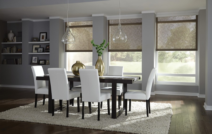 Photo is of an elegant dining room with motorized shades.